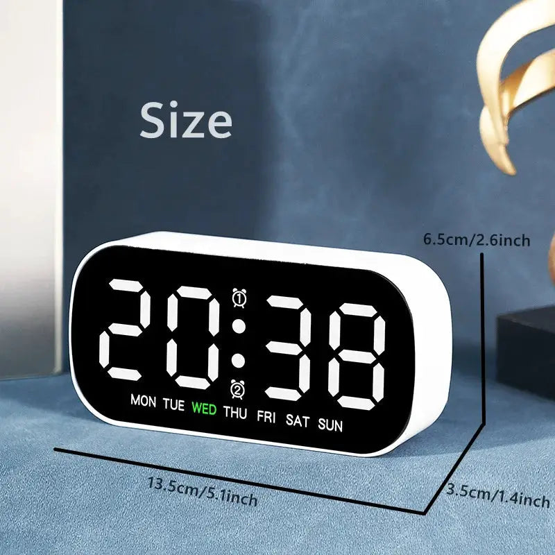 Simples Market digital alarm clock with USB power, black LED display on white case showing weekday indicators.