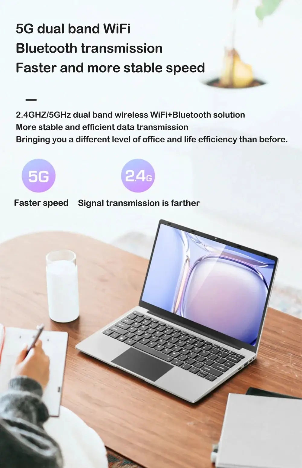 14.1-inch silver laptop on a wood desk, open to blue wallpaper screen.