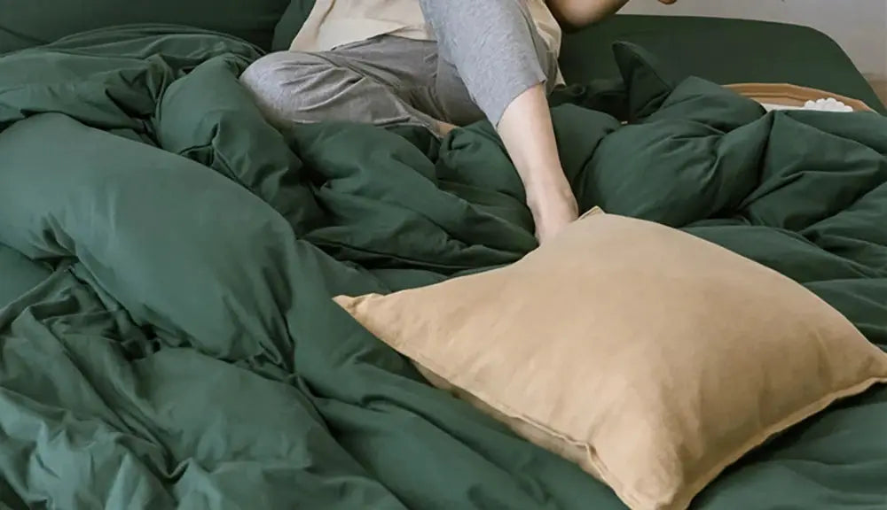 Decorative ramie cushion cover in beige on dark green boho farmhouse bedding