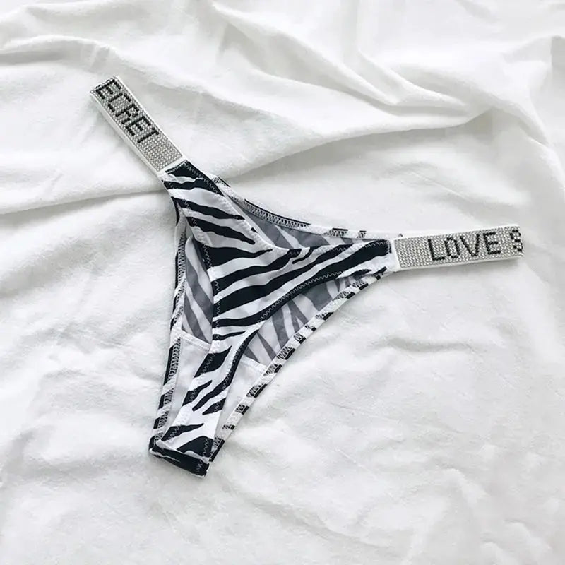 Zebra print women's low-waist thong with rhinestone LOVE lettering on waistband