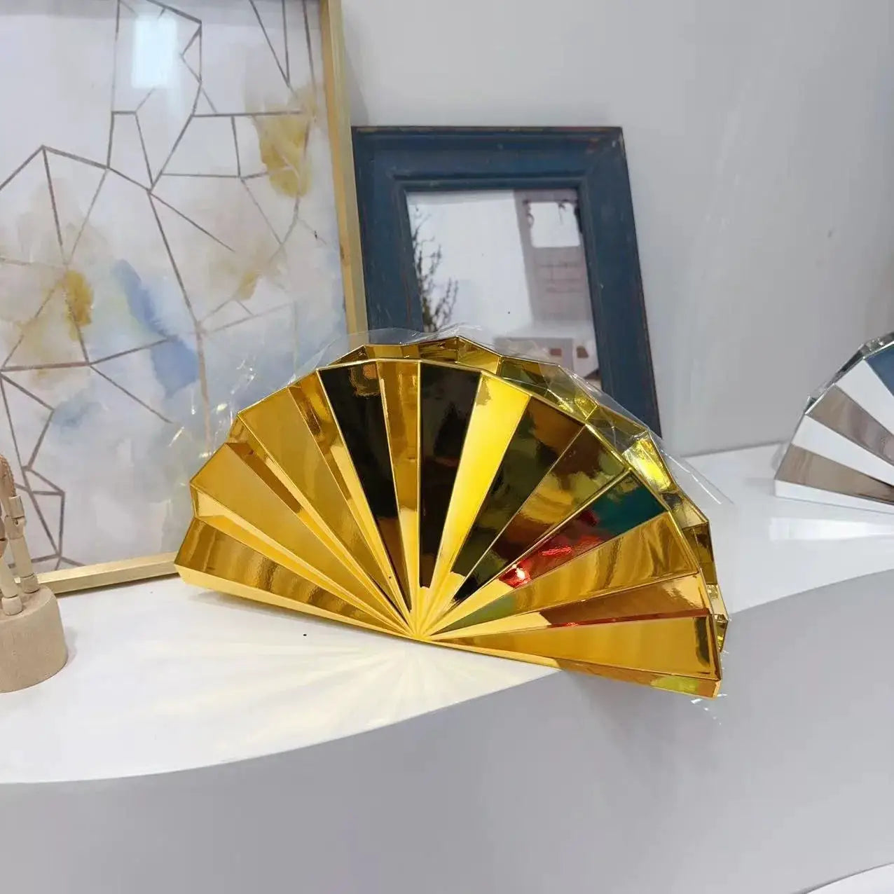 Fan-shaped metal clutch purses, two in gold and silver, Simples Market evening bags