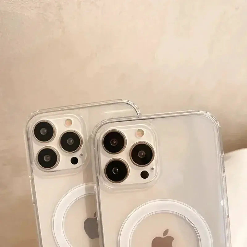 Pair of clear MagSafe iPhone cases with circular magnetic ring for Apple iPhone models.