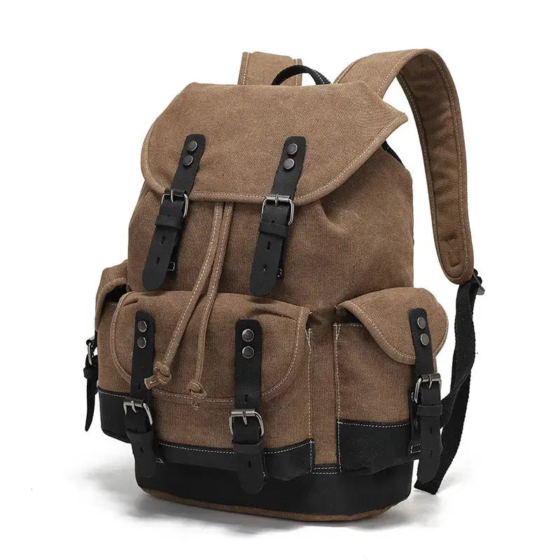 Vintage canvas backpack for men in brown waxed canvas with black buckle straps and multiple front pockets