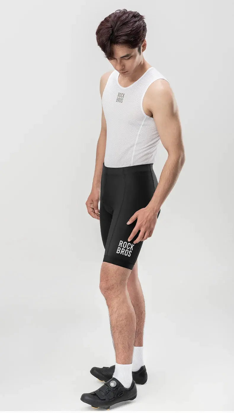 ROCKBROS men's black cycling shorts with logo on the leg, shown with a white sleeveless top