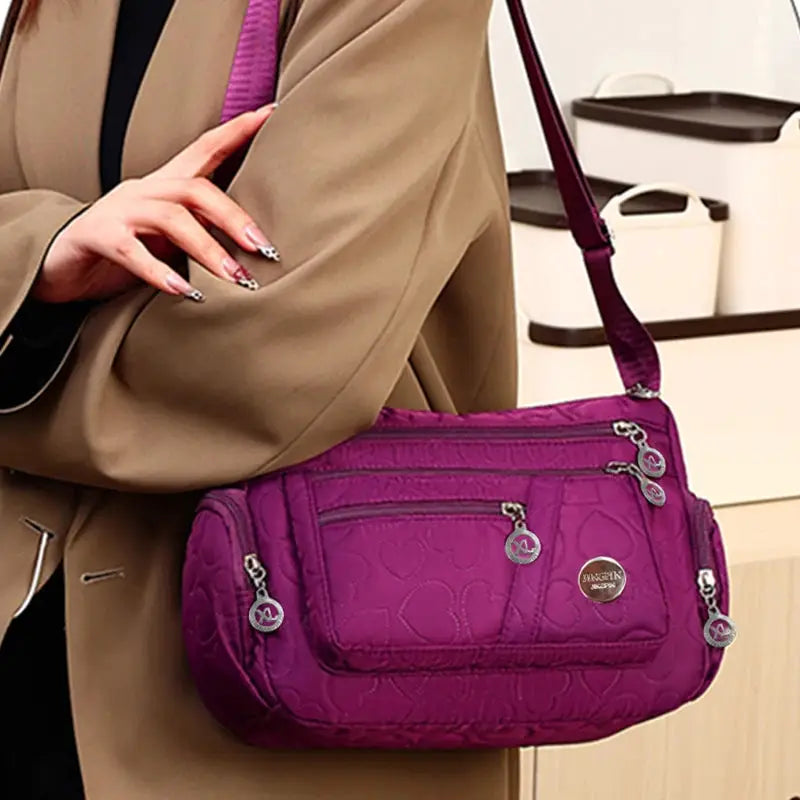 Crossbody handbag in purple nylon with multiple zip pockets and Simples Market logo