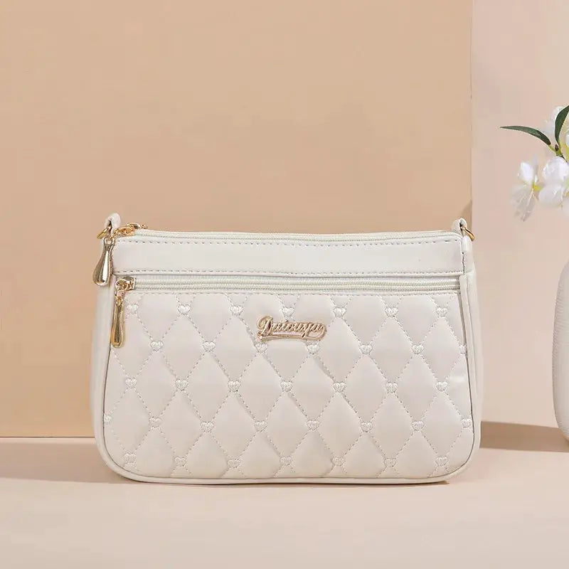 NovaLuxe PU Leather Messenger Bag For Women With Fur Ball Accent And Secure Zipper Closure