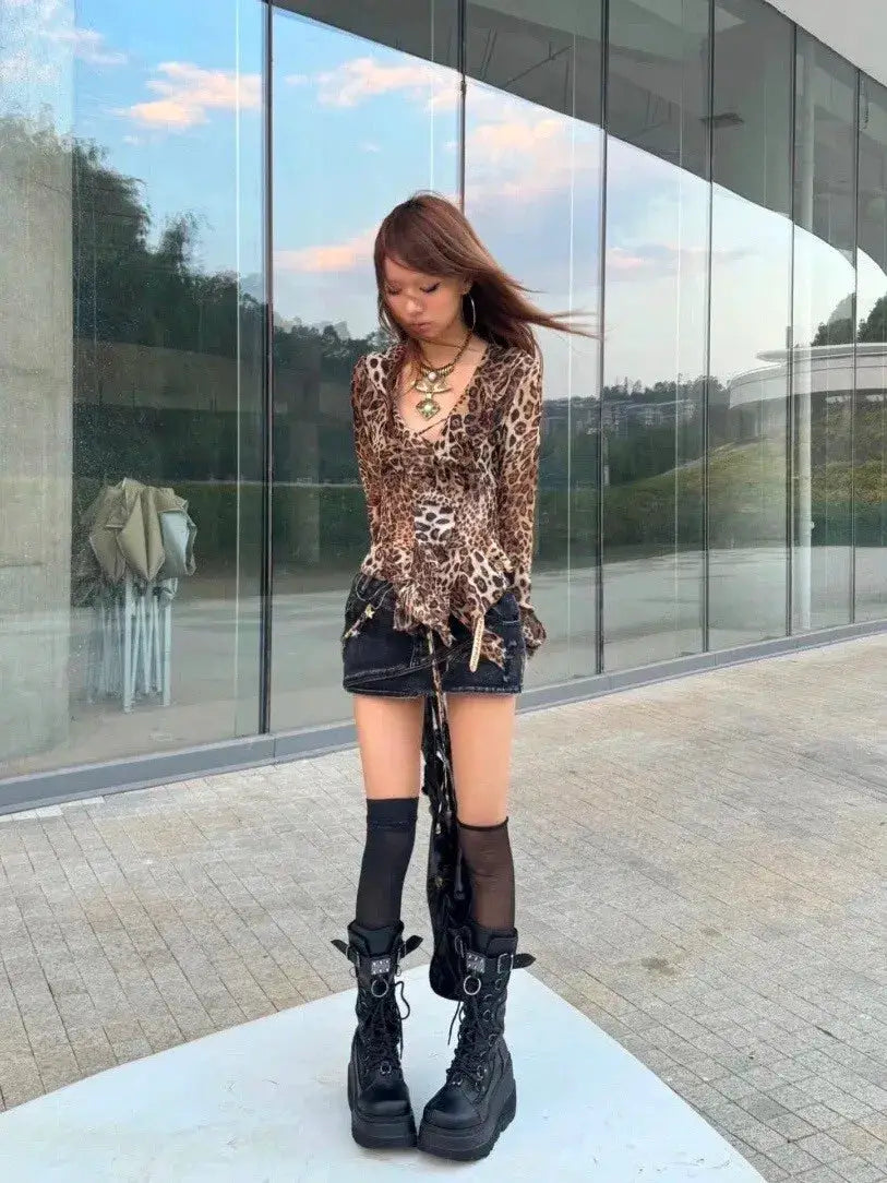 karrram leopard-print Y2K shirt by Simples Market, Vneck, brown/black pattern, paired with black mini skirt and boots