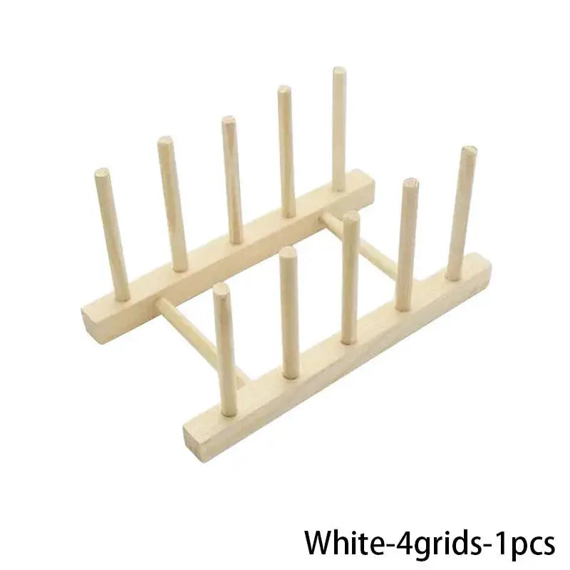 Wooden dish drying rack with peg-style supports for kitchenware; natural wood finish