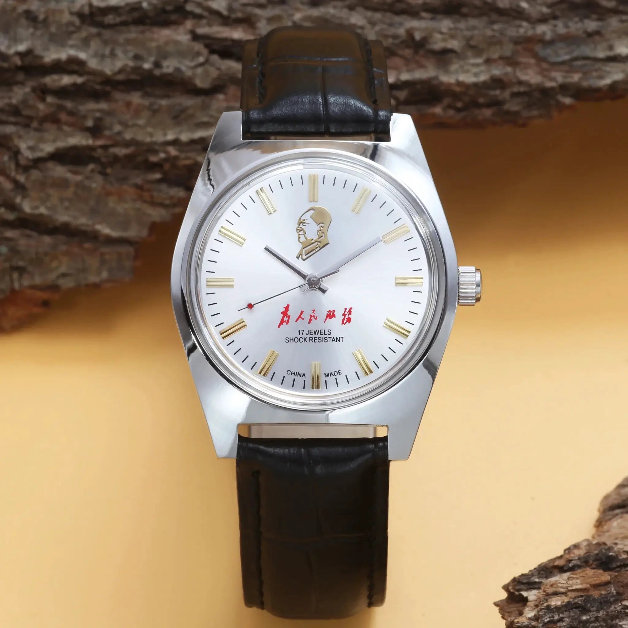 7120 hand-wind mechanical men's watch, 36mm silver case, white dial with gold baton markers, black leather strap
