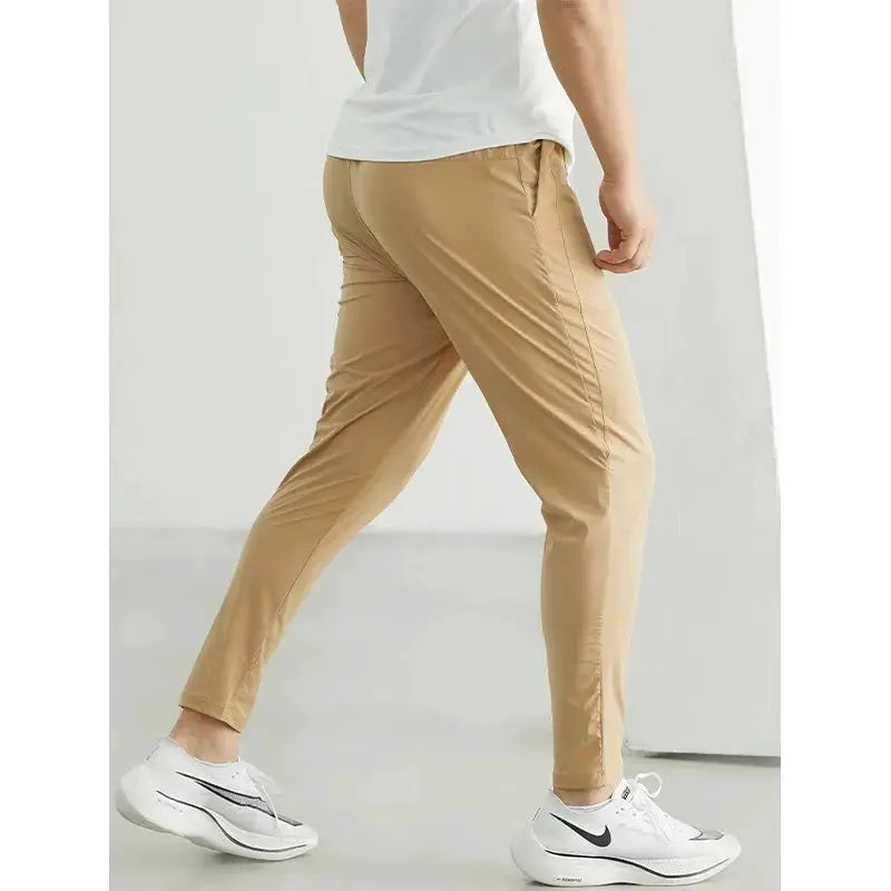 Men's running pants by Simples Market in tan, elastic waist, quick-dry tracksuit trousers for gym training