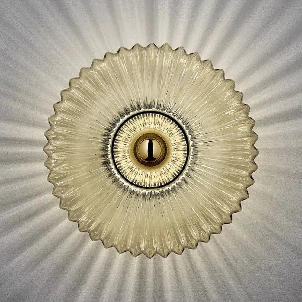 Nordic LED glass wall sconce by Simples Market; round sunburst shade with warm ambient light