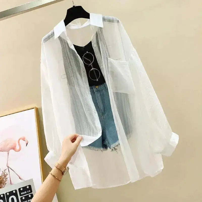 White sheer chiffon blouse, loose-fit see-through top layered over black tank with denim shorts
