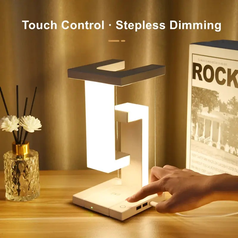 Floating lamp with detachable wireless charger in white, featuring touch-control dimming.