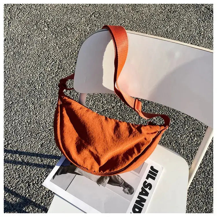 Casual nylon hobo crossbody bag in burnt orange with long shoulder strap