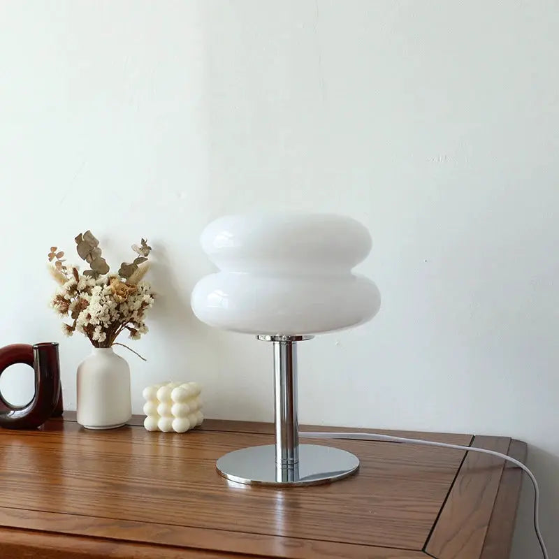 Macaron glass table lamp by Simples Market; white double-lobed shade with a chrome pedestal, dimmable night-light.