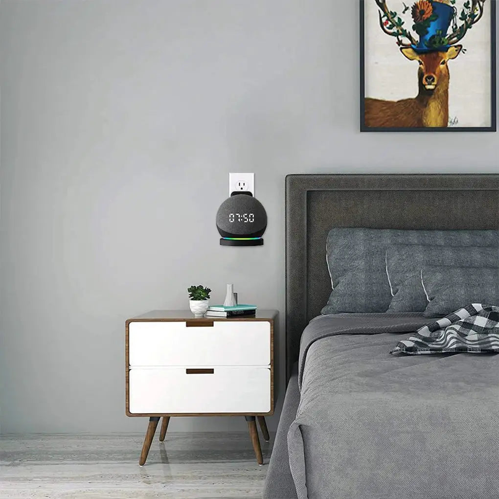 Echo Dot wall mount bracket by Simples Market with cord management; black circular speaker holder on wall.