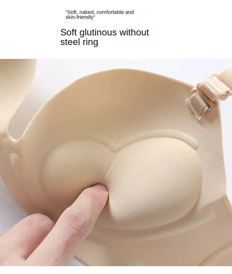 Women's seamless wireless bra in beige; strapless with molded cups and light push-up padding.