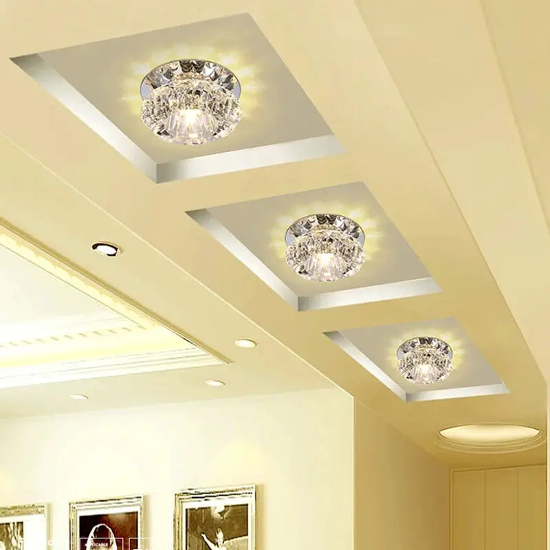 Aisle flush LED ceiling lamp trio with crystal shades; metallic trim, three lights