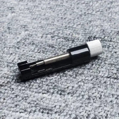 Simples Market metal watch link pin remover tool; black body with silver knurled knob for bracelet adjustment