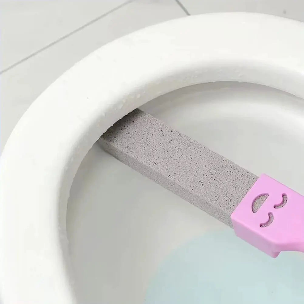 Pumice stone toilet cleaner with pink plastic handle for dirt removal