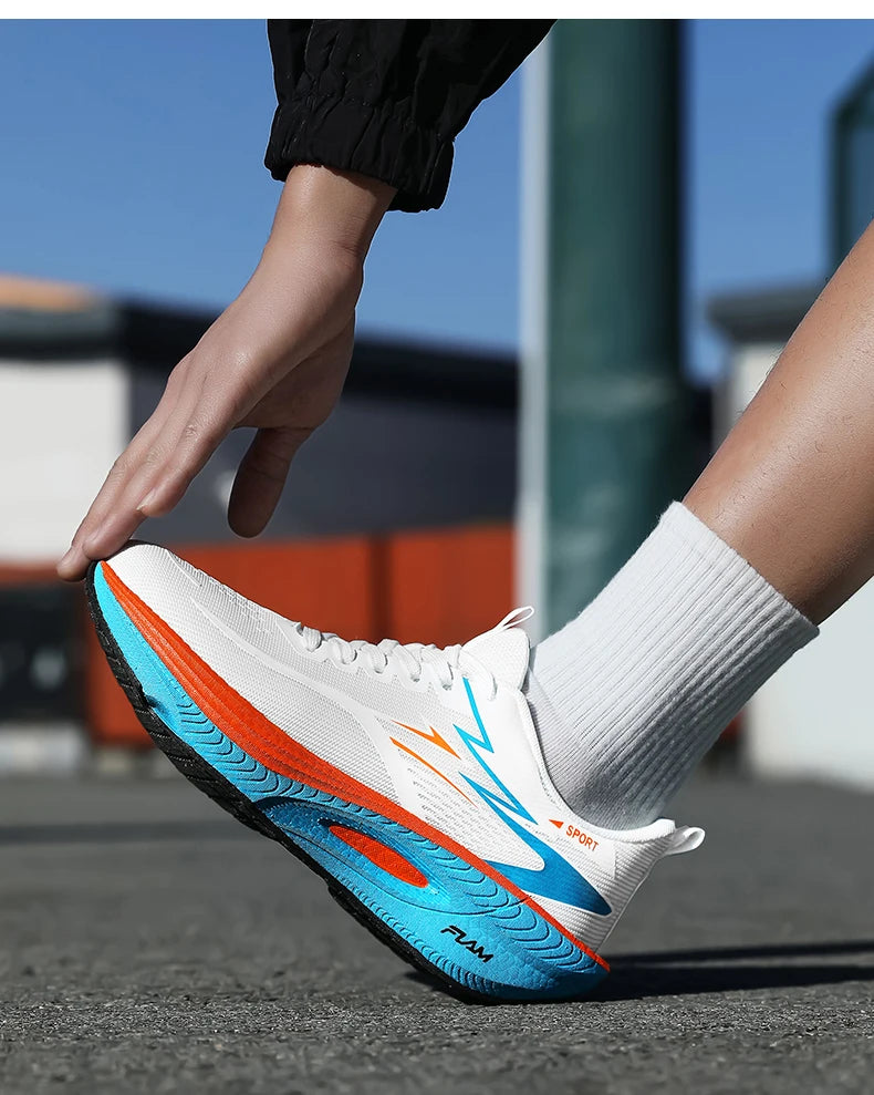 Men's white running shoes with blue/orange outsole; breathable, lightweight athletic sneakers