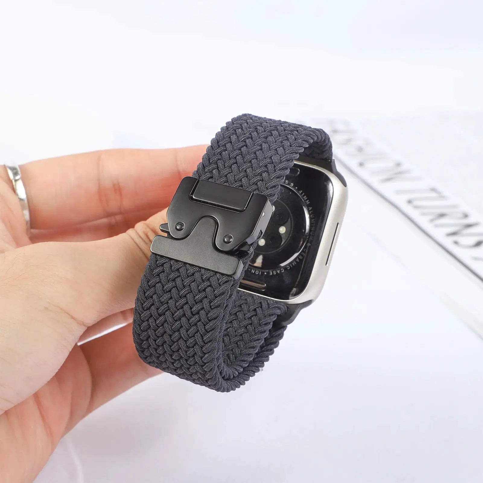 Parachute strap for Apple Watch by Simples Market in dark gray braided nylon with a black metal clasp
