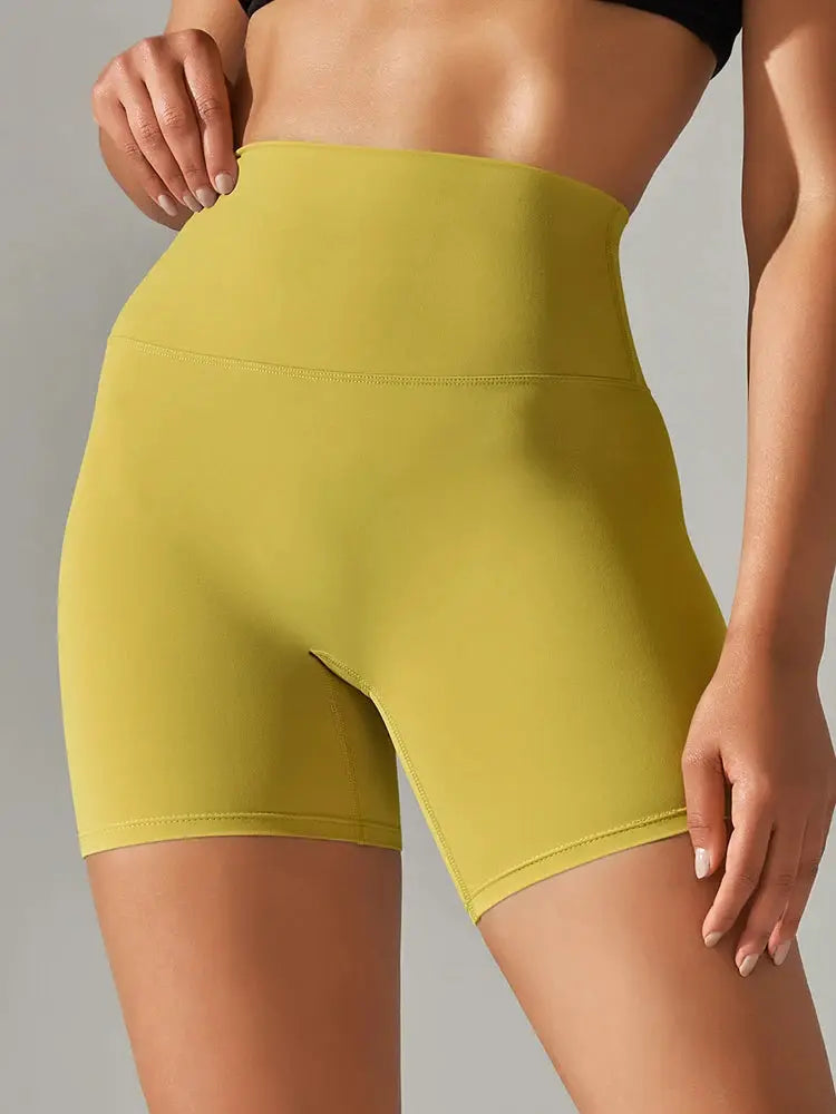 Women's yellow high-waist athletic shorts for yoga and workouts