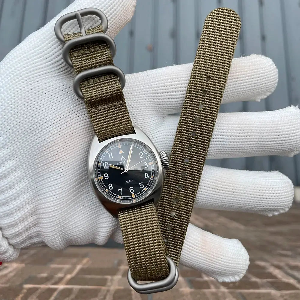 STEELFLIER SF745 unisex 36mm quartz dive watch with stainless case and olive NATO strap (spare strap included).