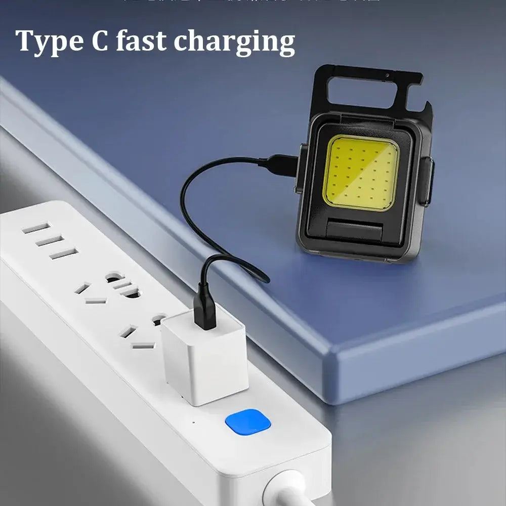 Mini flashlight keychain light with COB LED panel, USB rechargeable, black with foldable 90° side lights