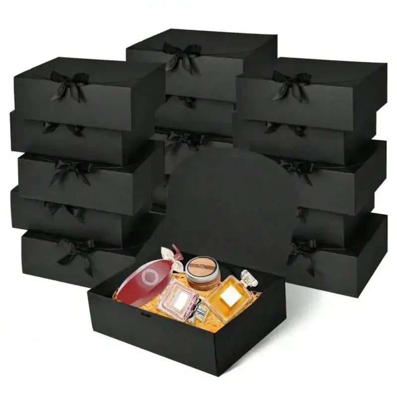 Simples Market black gift box set with lids and ribbons; open box shows perfume bottle and small gifts