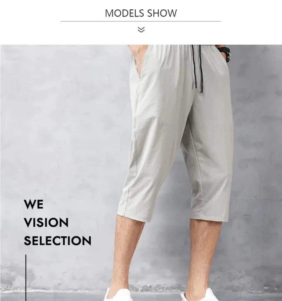 3/4 Length men's shorts by Simples Market, light gray nylon stretch with drawstring waist, quick-dry.