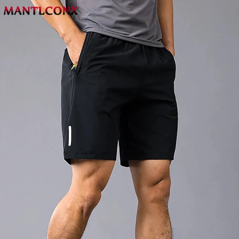 Men's black athletic shorts with elastic waist, breathable quick-dry fabric, side pockets, MANTLCONX.
