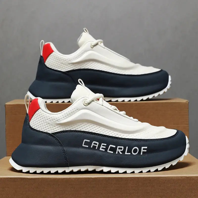 Pair of men's lightweight non-slip running shoes in white and navy with red heel tab; CAECROF branding on the side.