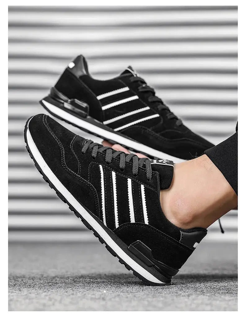 Men's black artificial leather casual sneakers with white stripes and lace-up