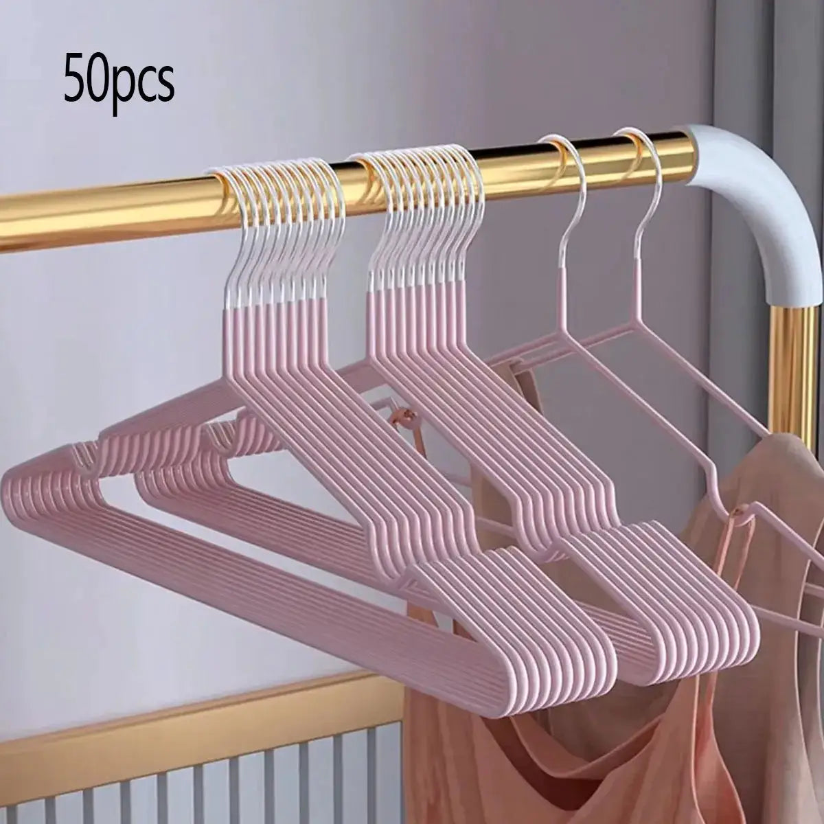 50pcs pink metal seamless anti-slip clothes hangers on a gold rod, space-saving