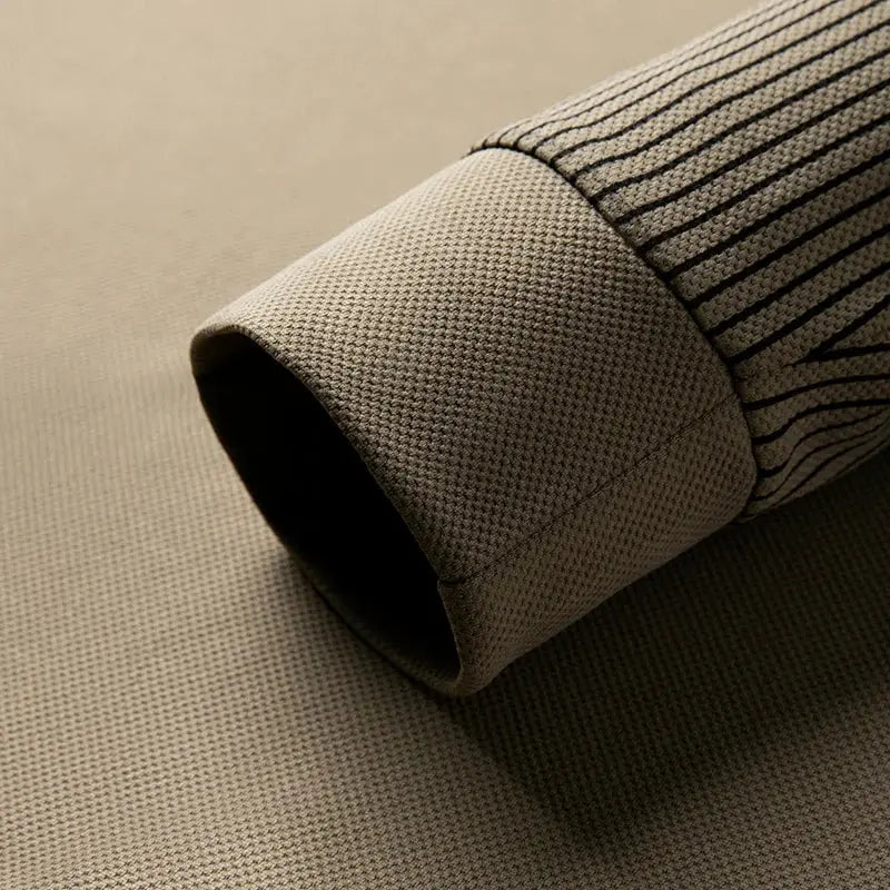Men's long-sleeve polo shirt in beige knit with textured fabric and dark striped sleeves