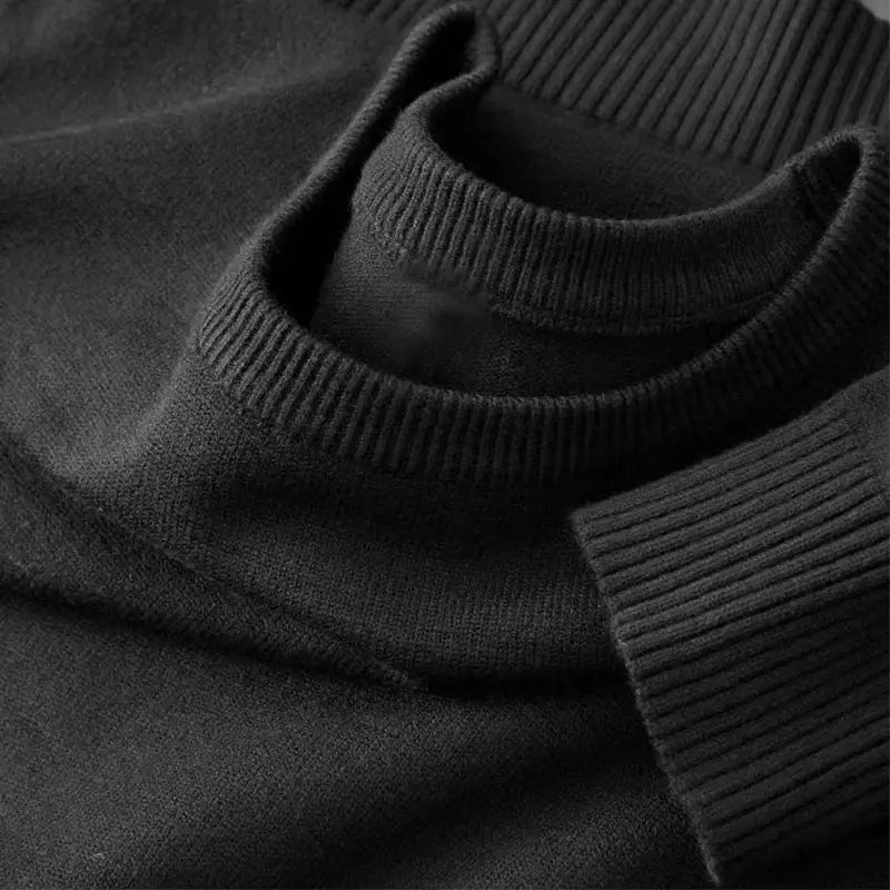 Men's black knit crewneck pullover sweater, long sleeves with ribbed cuffs
