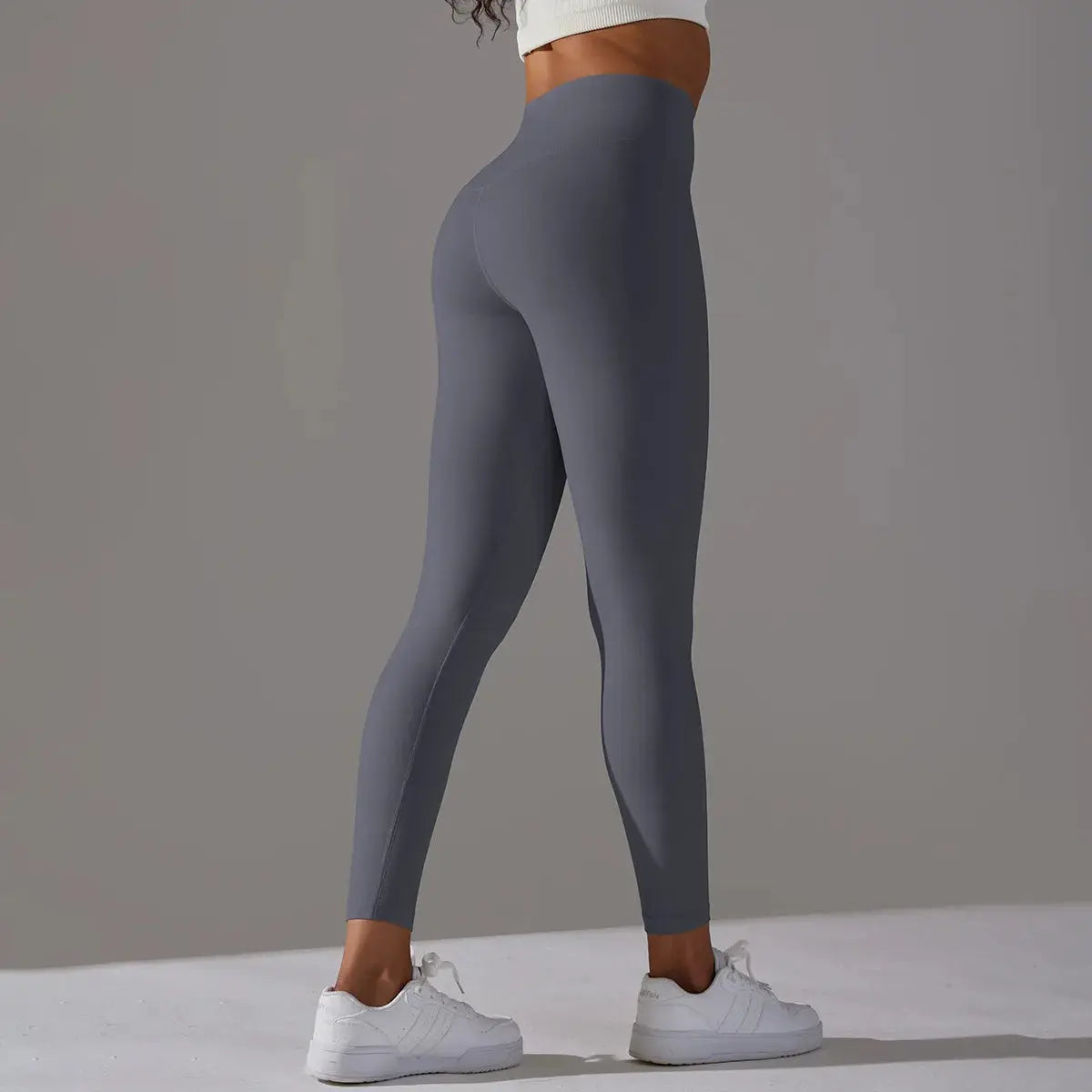 Blue-gray high-waist leggings for women; gym, running, and yoga tight activewear.