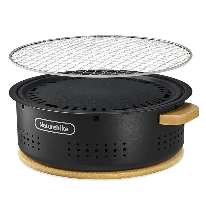 Naturehike tabletop charcoal BBQ stove; black metal body, wooden side handle, and metal grate