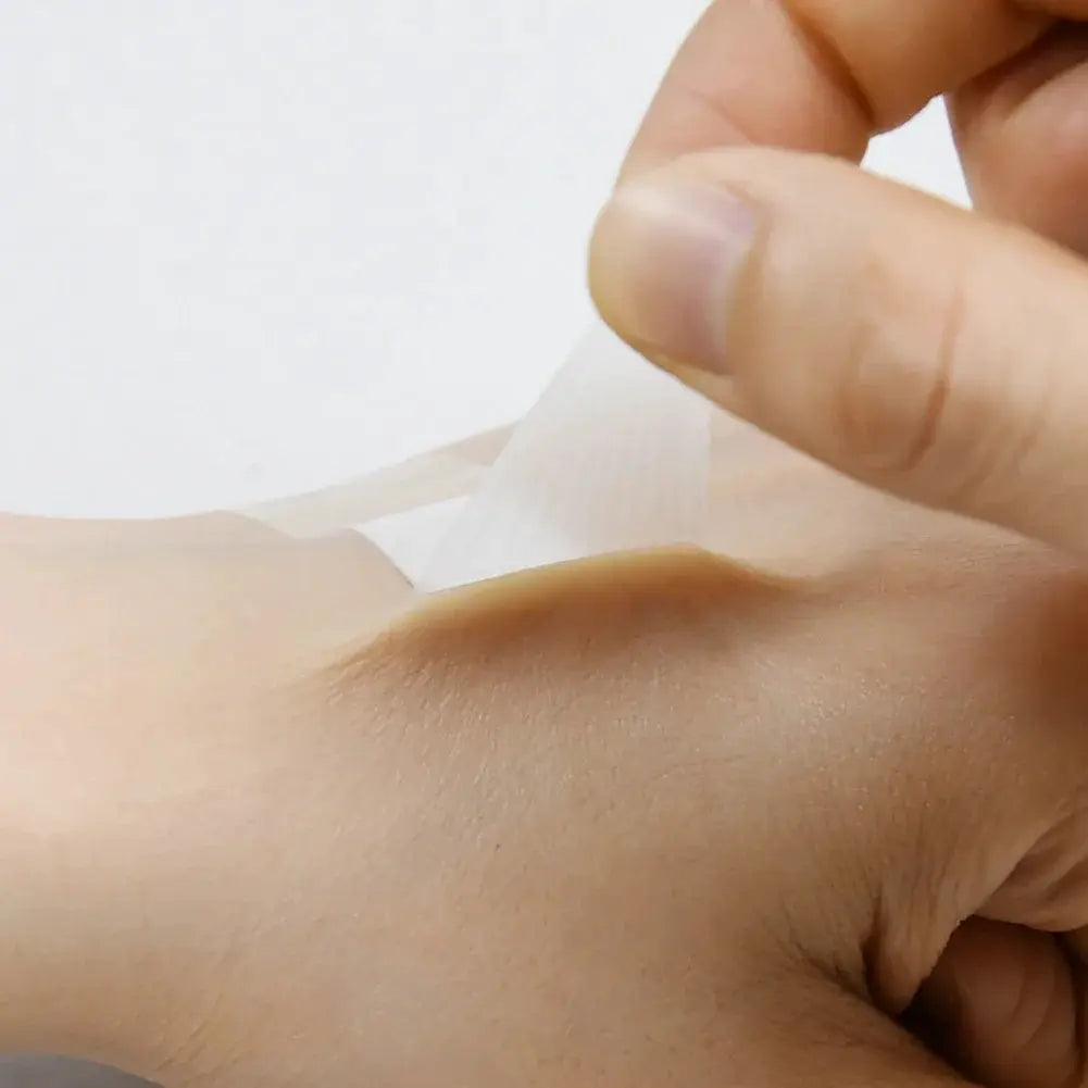 Transparent waterproof adhesive wound plaster by Simples Market being applied to skin