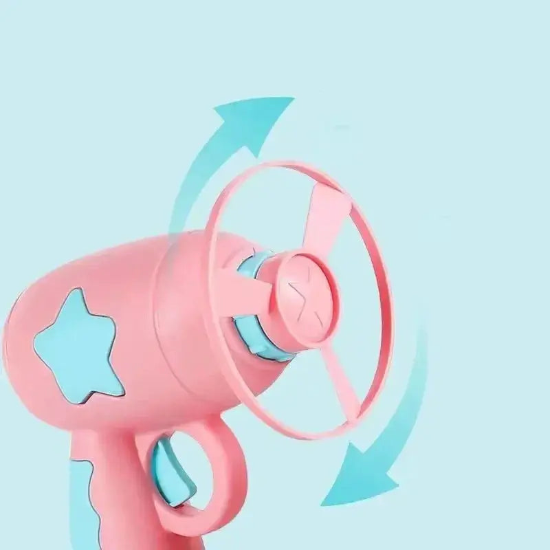 Interactive cat toy launcher, pink with blue star accent, mini flying-disc shooter for kittens