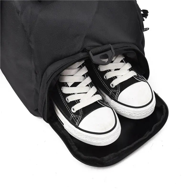 Simples Market gym bag, black waterproof sport backpack with shoe compartment and a pair of white sneakers.
