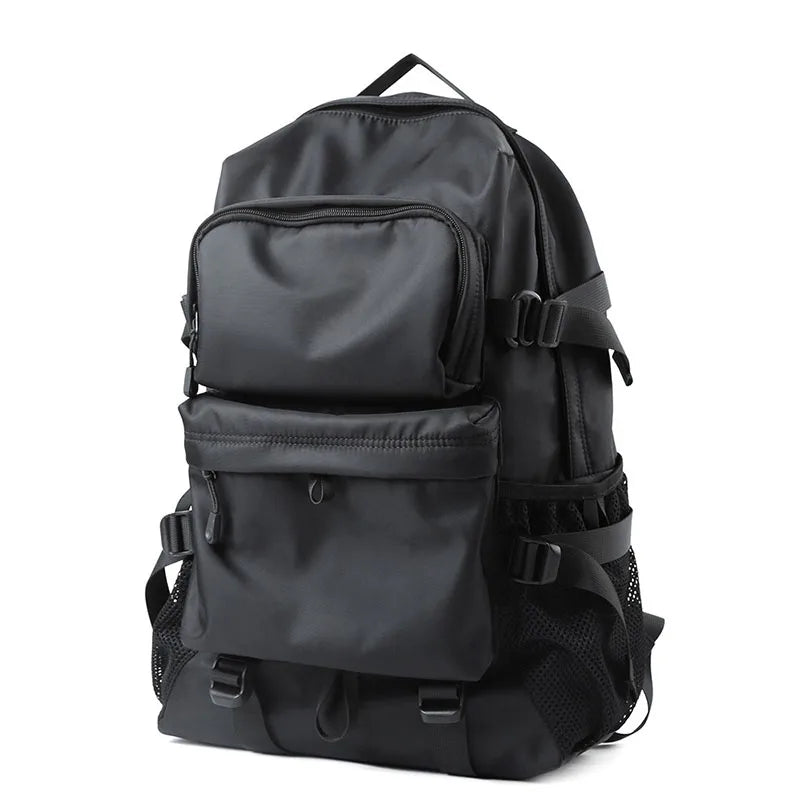 Laptop travel backpack in black with multiple compartments and a side mesh pocket