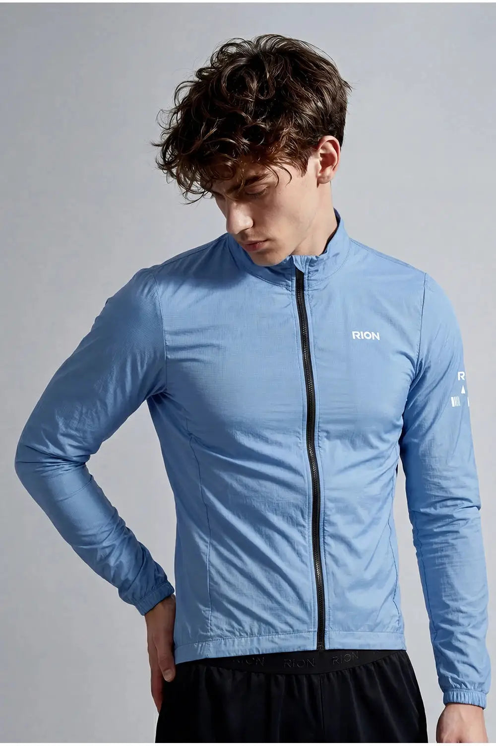 RION men's light-blue long-sleeve windbreaker with full-zip front