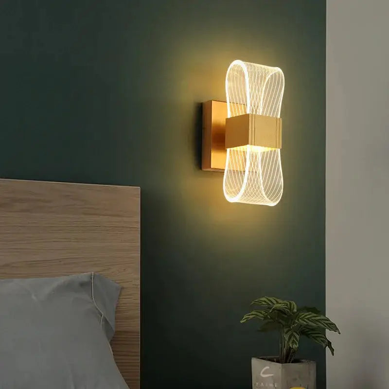 Nordic luxury LED wall lamp, aluminum bedside light with decorative loop design and warm glow by Simples Market