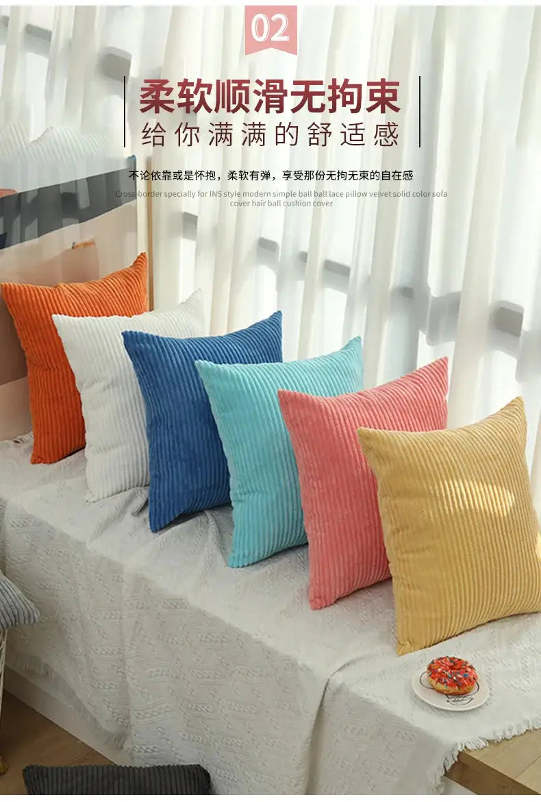 Simples Market corduroy pillow covers set; 7 colorful cushions on a white textured throw.