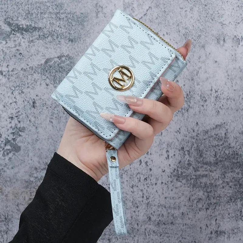 Simples Market compact light-blue PU wallet with printed pattern, zipper coin pouch, multi-card slots, and wrist strap