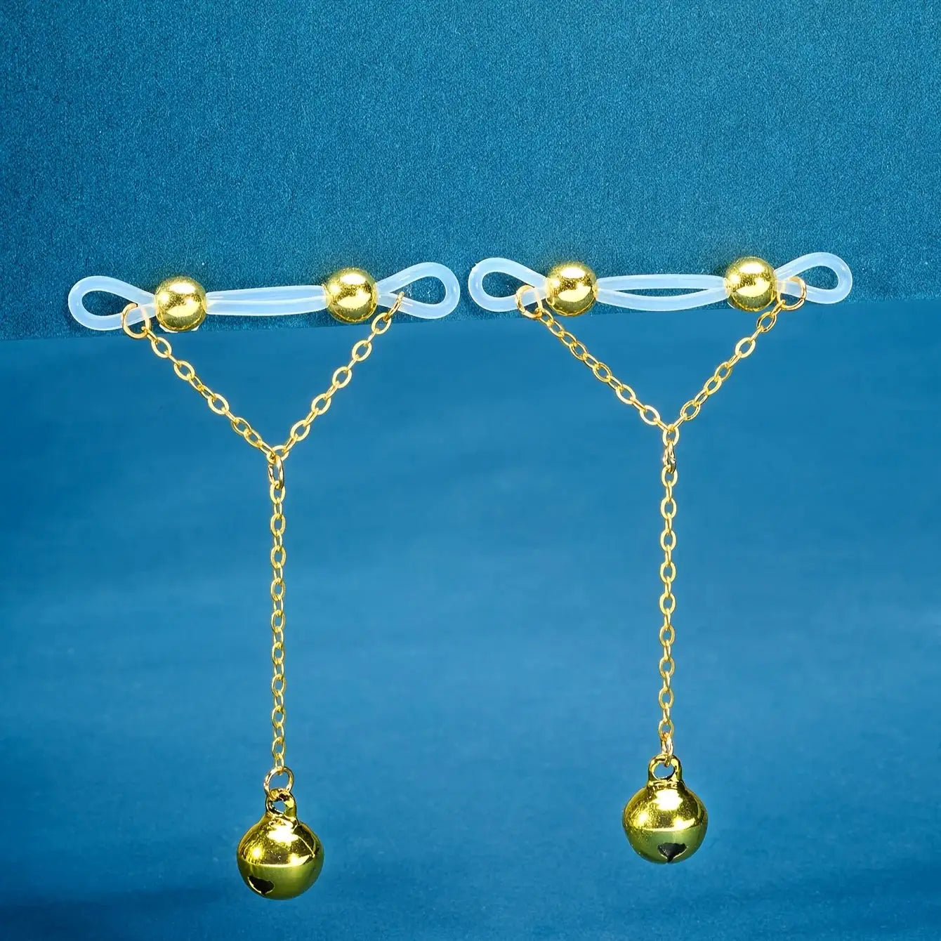 1 pair adjustable no-pierce nipple rings with clear acrylic loops, gold beads, and dangling gold chains with bells