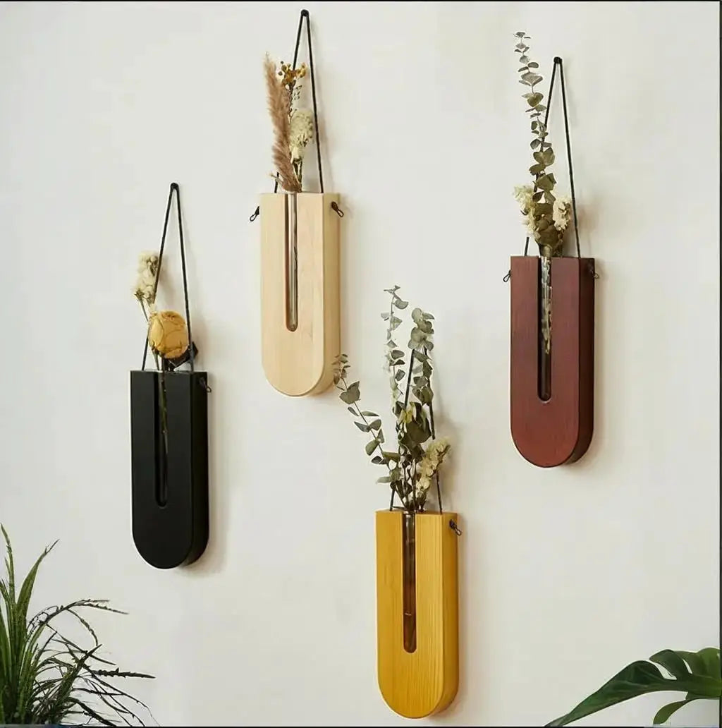 Wooden hanging planters by Simples Market; five Bohemia propagation vases in black, natural, brown, and mustard yellow.