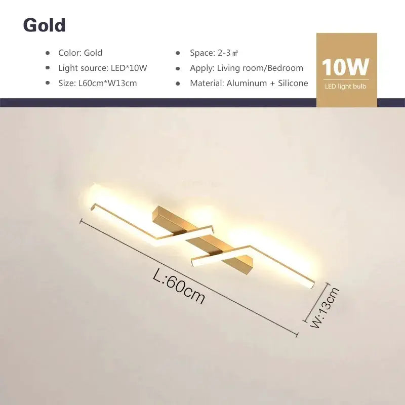 Modern LED ceiling light in gold finish with a simple linear design; 60cm long, aluminum + silicone by Simples Market
